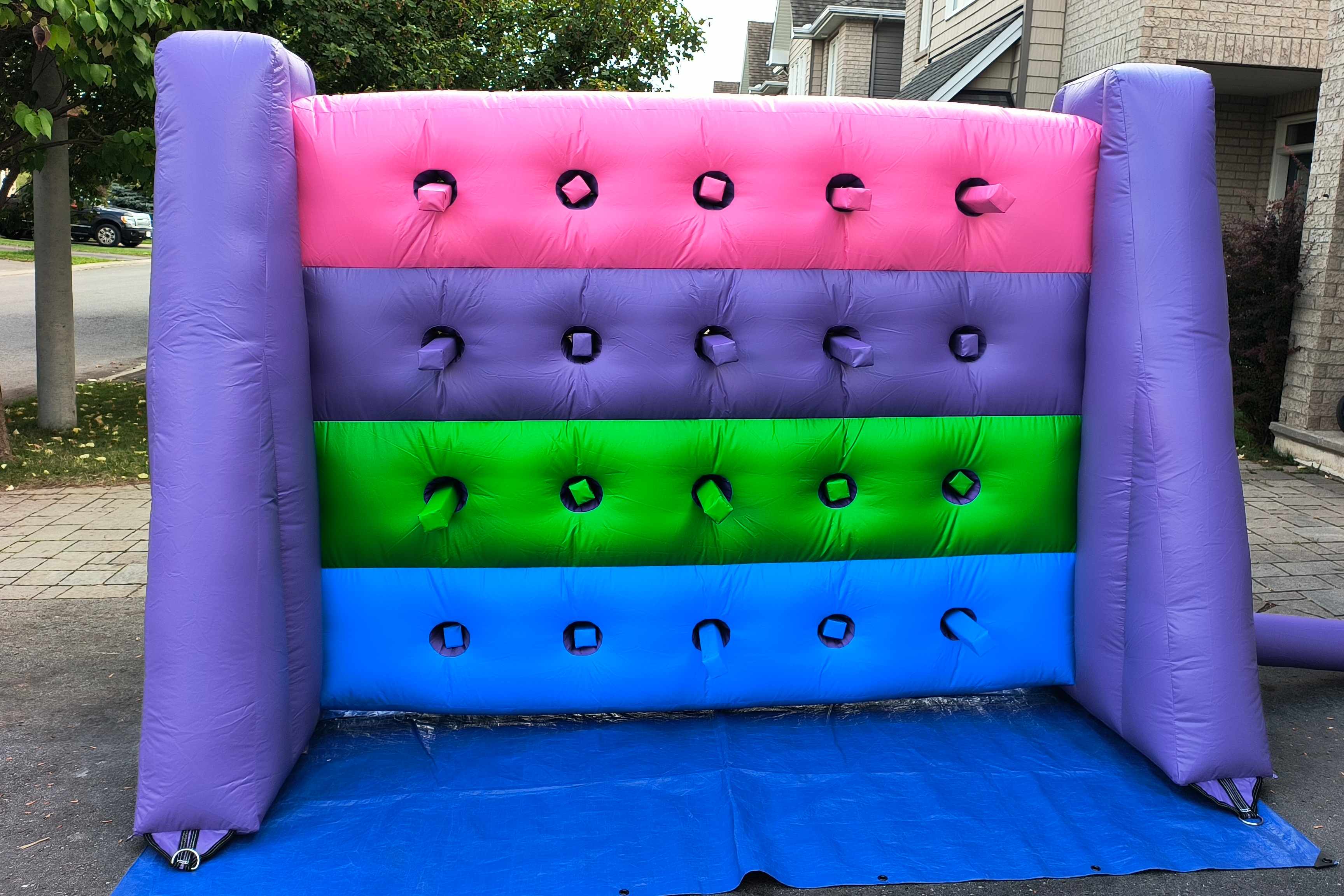 Family fun with Whack a Wall inflatable game rental at a backyard party in Gatineau